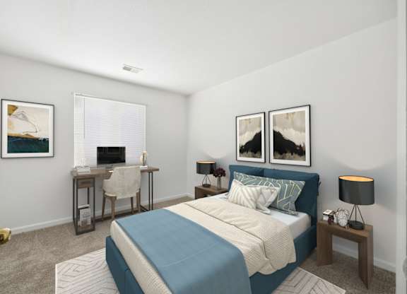 A bedroom with a bed, desk, and chair.