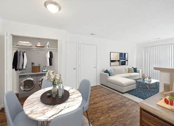 A modern living room with a round table and chairs.