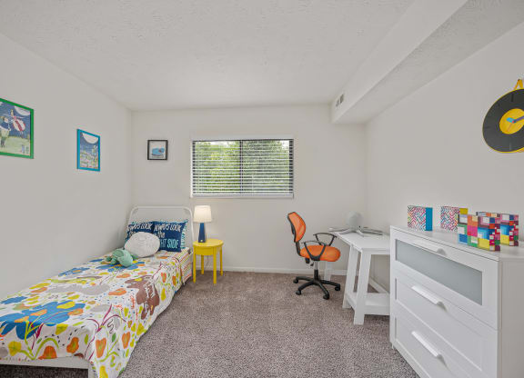 a bedroom with a bed and a desk at The Woodridge Collection, Fairfield