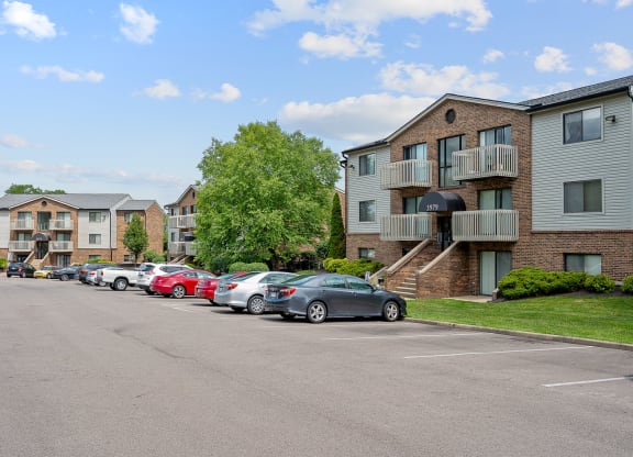 a parking lot at the whispering winds apartments in pearland, tx at The Woodridge Collection, Fairfield, 45014
