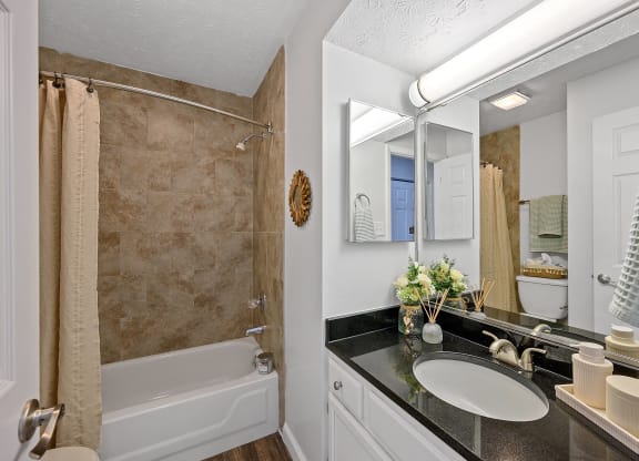 Bathroom with a shower and a sink and a mirror at Wrights Point, Ft Wright