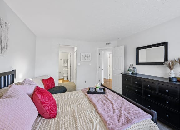 Bedroom with a bed and a dresser and a mirror at Wrights Point, Ft Wright, KY