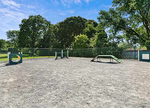 A park with a picnic table and a fence at Rose Hill Apartments, Alexandria, VA