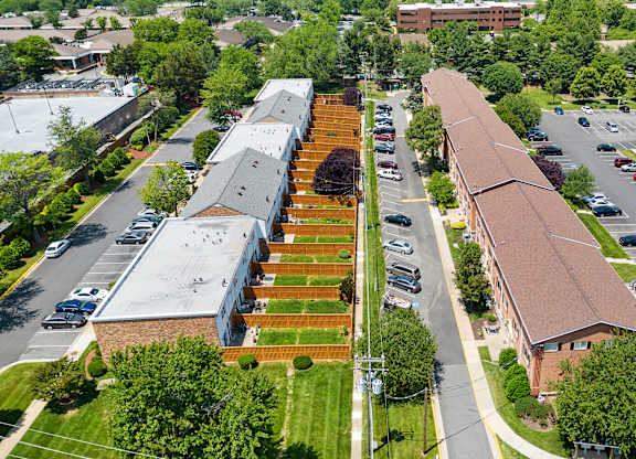 an aerial view of a church and a parking lot at Gainsborough Court Apartments, Fairfax, Virginia