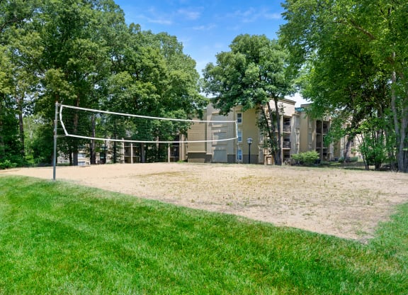 the volleyball court is in front of the building