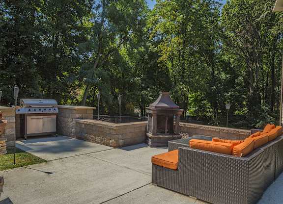 BBQ area with fire and couch area at Tysons Glen Apartments and Townhomes, Falls Church, VA, 22043