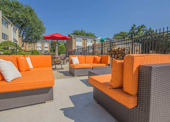 Orange outdoor couches in sunshine at Tysons Glen Apartments and Townhomes, Virginia