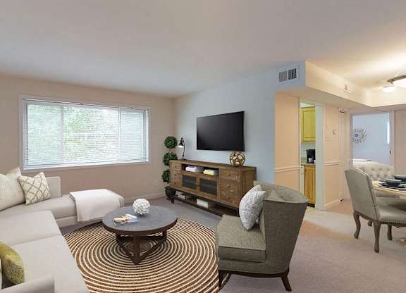 Living room area with modern furniture  at Woodlee Terrace Apartments, Woodbridge, Virginia
