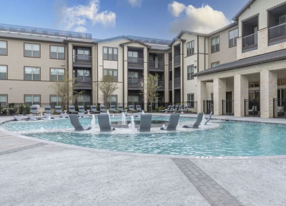 Resort-Style Pool with Grilling Area, Tanning Ledges, Cabanas & Hot Tub at The Bridge at McKinney