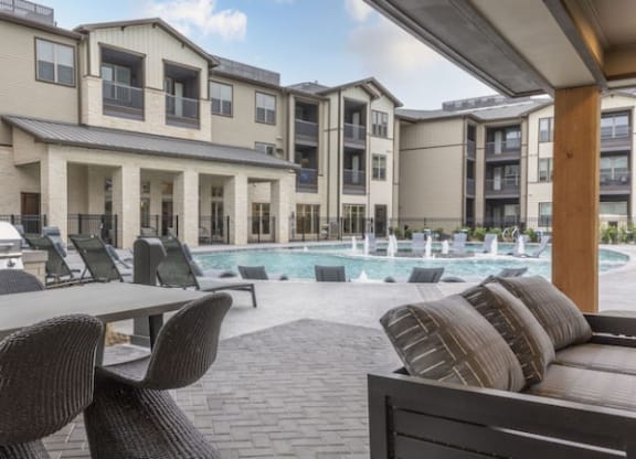 Resort-Style Pool with Grilling Area, Tanning Ledges, Cabanas & Hot Tub at The Bridge at McKinney