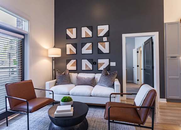 a living room with a couch and a table at Sterling Nashville West Apartments, Nashville, TN, 37209