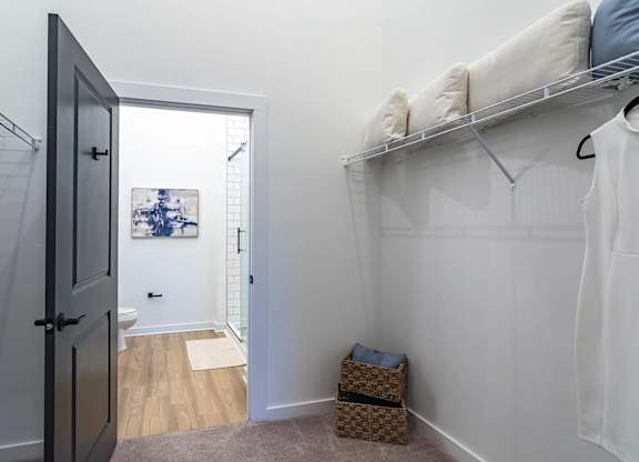 a bedroom with a closet and a door to a bathroomat Sterling Nashville West Apartments, Tennessee