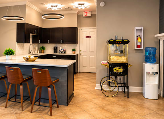 A kitchen with a bar area and a bicycle on display.