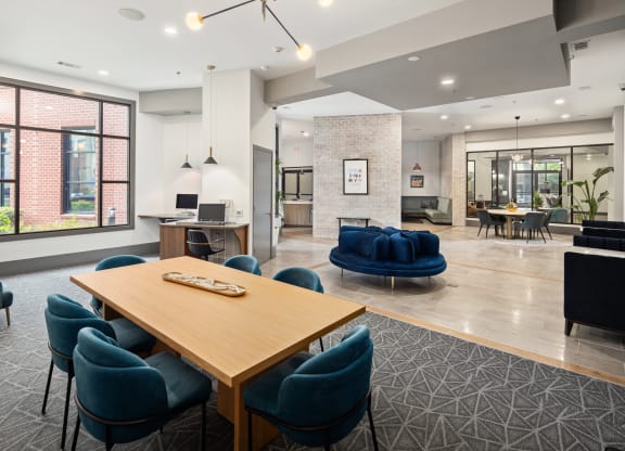 a communal area with a table and chairs