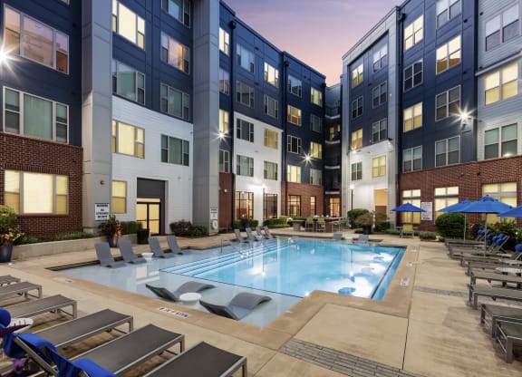 our apartments offer a pool and lounge area atrium at theria on  photo