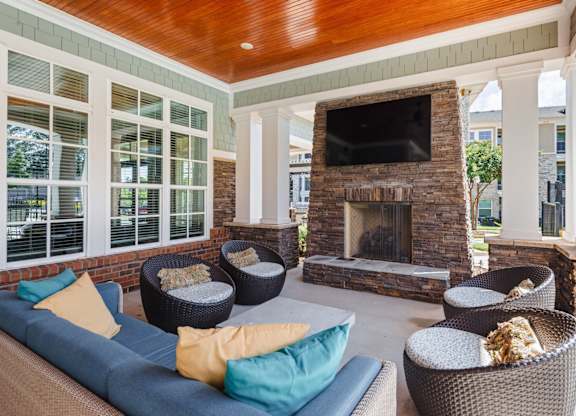 A living room with a fireplace and a television.
