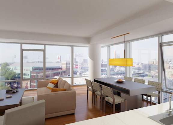 A modern living room with a large window overlooking the city.