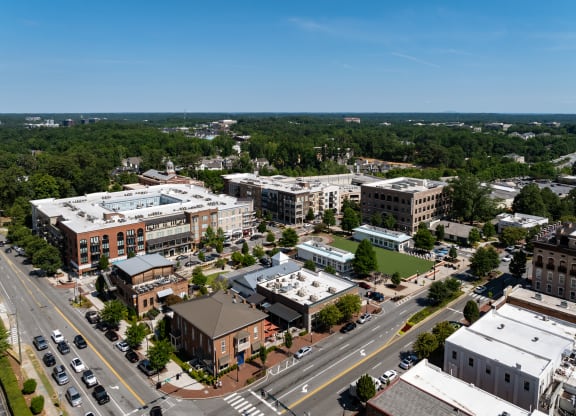 an aerial view of a city with buildings and trees