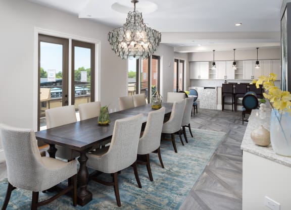 a dining room with a long table and chairs