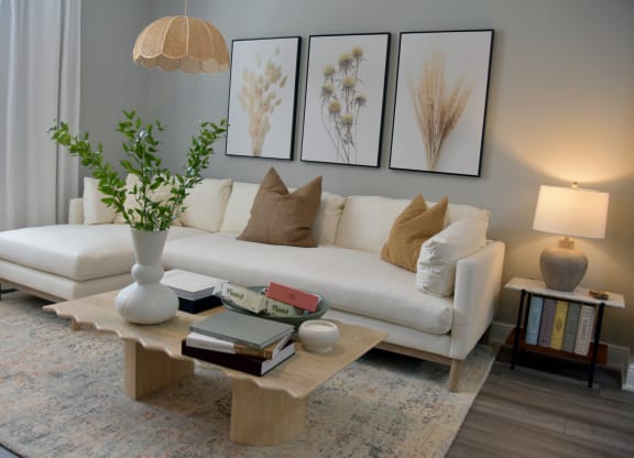 a living room with a white couch and a coffee table