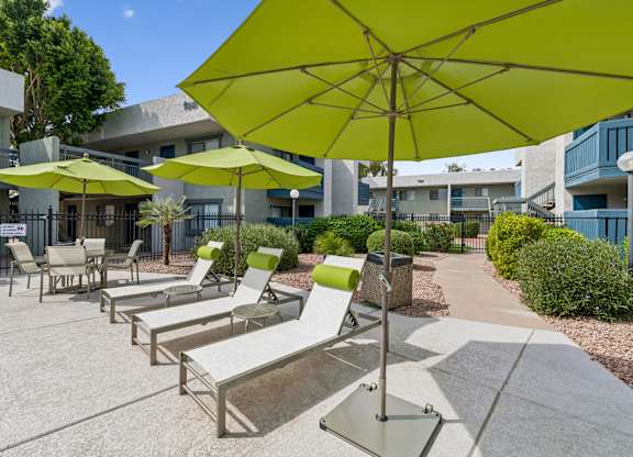 A sunny day at the outdoor seating area with green umbrellas.