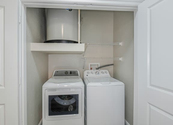a small laundry room with a washer and dryer