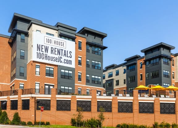 a building with a sign that reads 100 house new rentals at 100 House Apartments, New Jersey, 07310