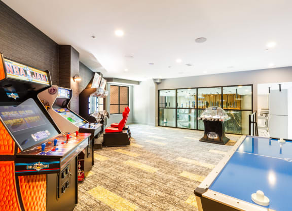 a games room with a pool table and a fireplace at 100 House Apartments, Jersey City , 07310