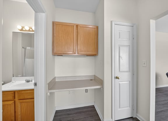 A classic style apartment with built in desk between bathroom and living room