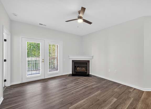 Renovated apartment living room with fireplace and balcony