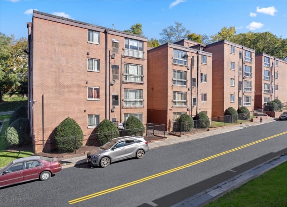a view of an apartment building from the street