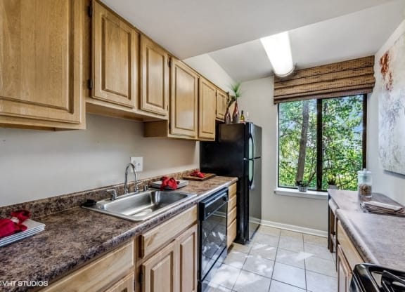 Updated Kitchen With Black Appliances at Brookland Ridge Apartments, Washington