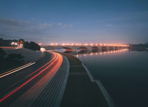a bridge over a body of water at night