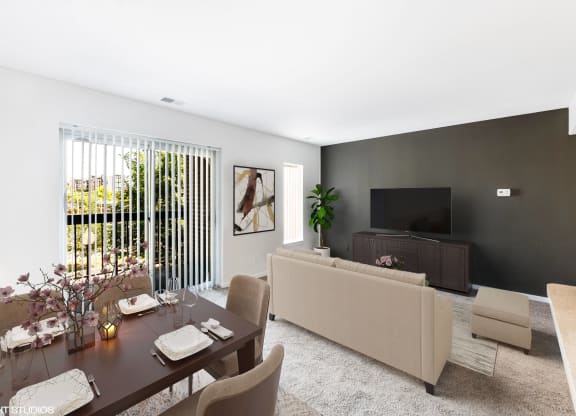 a living room with a table and a couch and a television