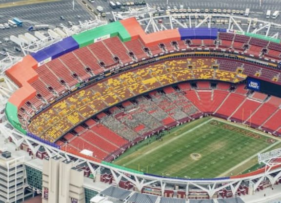 an aerial view of a stadium with a football field