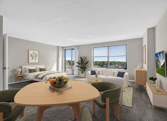 A modern living room with a dining table and chairs.