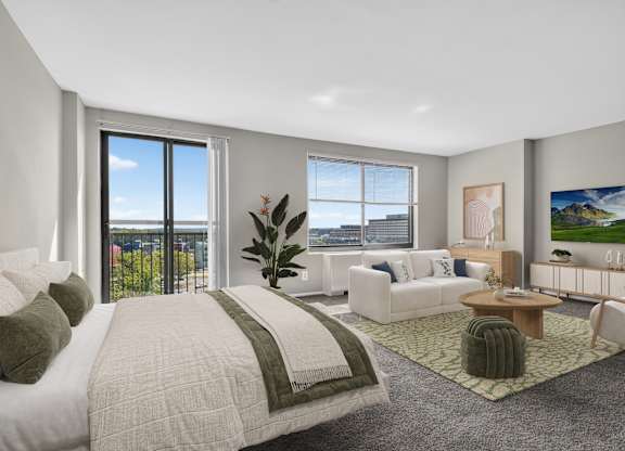 A bedroom with a large bed and a view of the city.