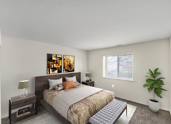 A bedroom with a bed, nightstand, and a plant.