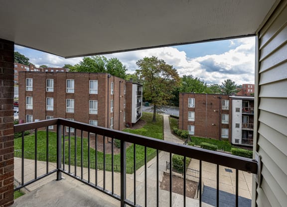 the view from the balcony of an apartment building on a sunny day
