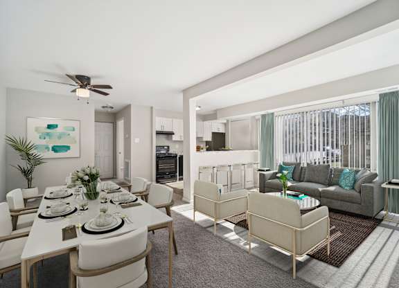A dining room with a white table and chairs.