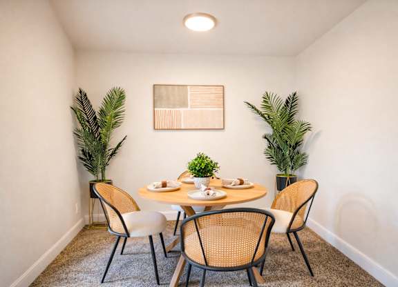 Dining area with round table and chairs at Highland Ridge Apartments, Capitol Heights, MD