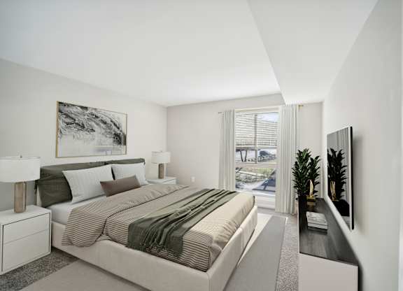 A bedroom with a large bed and a painting on the wall.