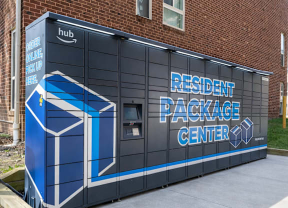 A brick building with a sign that says "Resident Package Center".