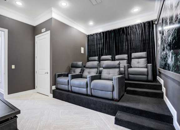 a living room with a couch and a tv at Century Lakeshore Crossings, Birmingham