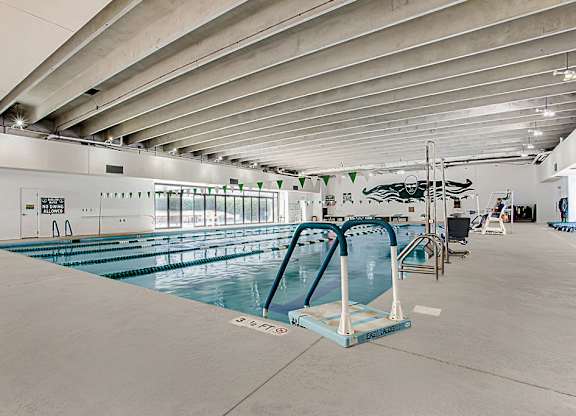a large indoor swimming pool with a diving board at Lory of Harbison, South Carolina, 29212