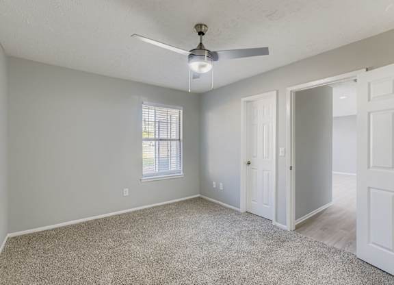 Empty Bedroom with a ceiling fan at Keita 1875, Georgia 30349