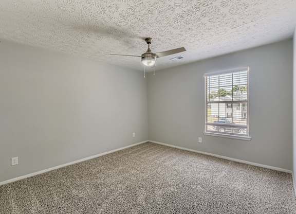 A room with a ceiling fan and a window with blinds at Keita 1875, College Park, 30349