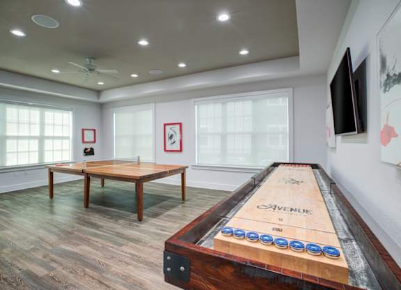 a games room with a shuffleboard table and a foosball table  Flyer at Century Avenues, Lakeland, FL, 33813
