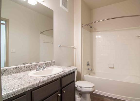 a bathroom with a sink toilet and shower at Century New Holland, Georgia
