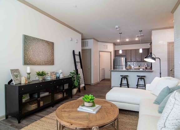 a living room with a couch and a table  at Century New Holland, Gainesville, 30501